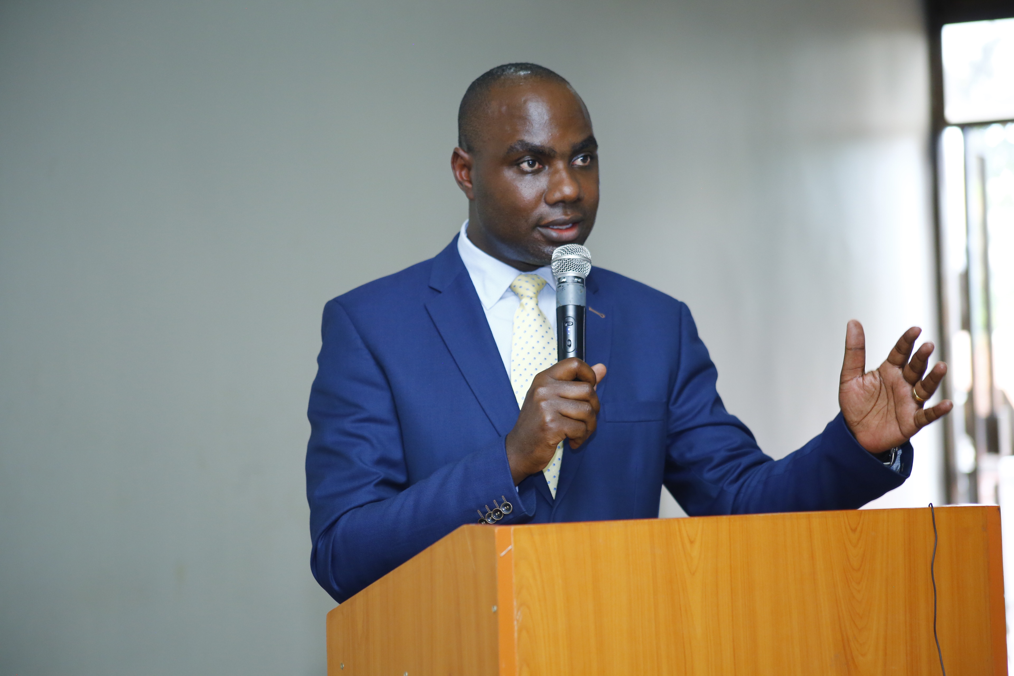 State Minister for Finance Hon. Musasizi Henry making his remarks at the Local Government Internal Auditors Association Annual General Meeting