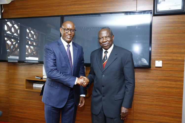 Finance Minister Matia Kasaija welcoming African Development Bank Vice- President Dr.Kevin Kariuki at MoFPED